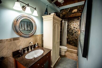 Home exchange in St John USVI, ensuite bathroom with stone wall shower