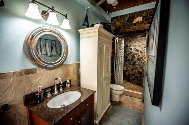 Home exchange in St John USVI, ensuite bathroom with stone wall shower