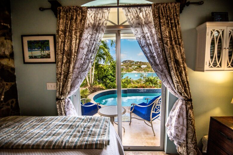 Home exchange in St John USVI, suite with sliding doors open to pool
