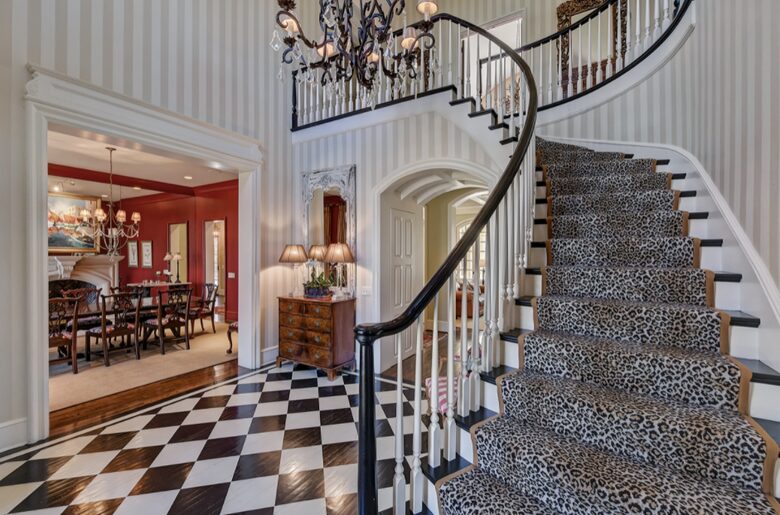Home exchange in Charlotte NC, curved staircase with runner in foyer