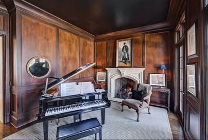 Home exchange in Charlotte NC, vintage study with piano and fireplace