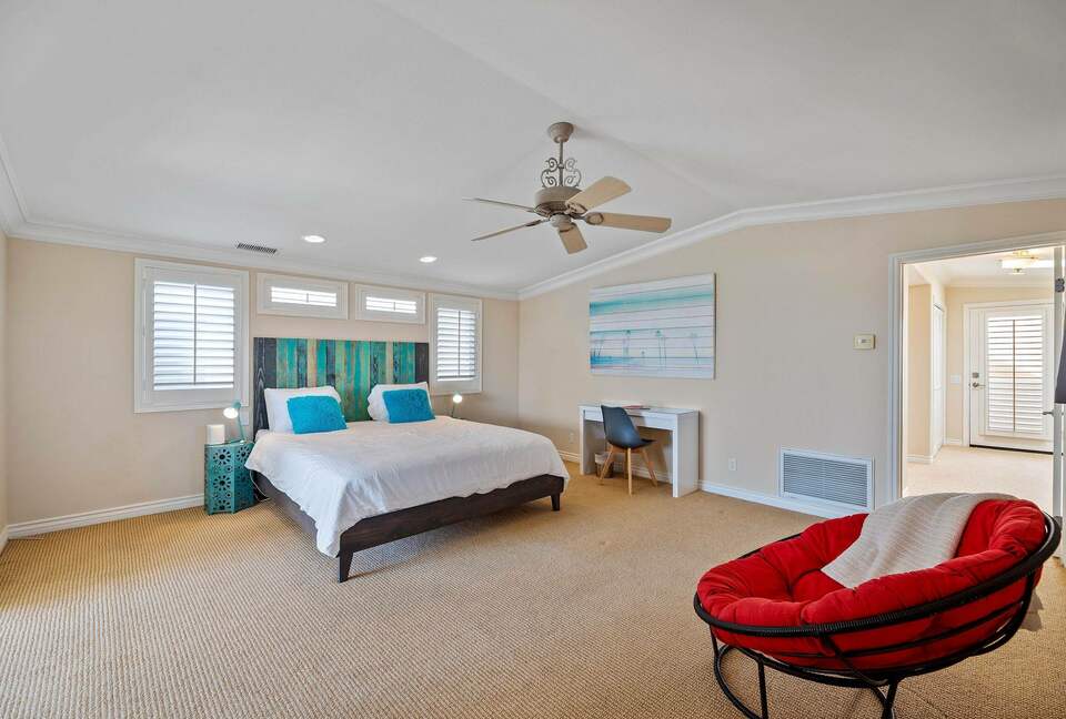 Home exchange in Oxnard CA, master bedroom with tufted papsan chair