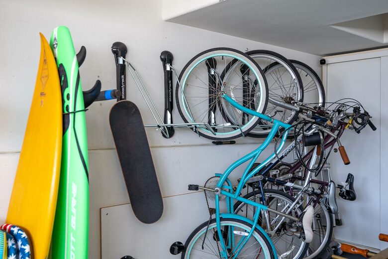 Home exchange in Oxnard CA, garage with bikes and surfboards