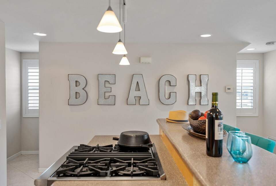 Home exchange in Oxnard CA with galvanized "beach" letter wall decor