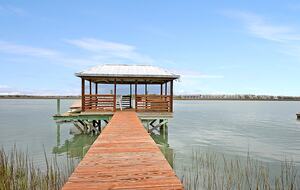 Enjoy beautiful sunsets and watch the dolphins swim by.