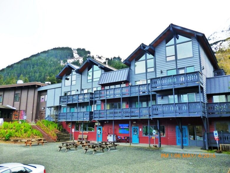 front of building with Alyeska in the background