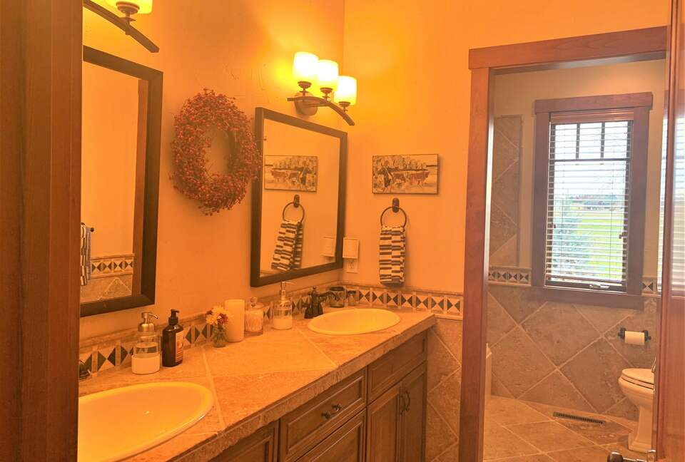 Home Exchange in Polson, Montana large guest bathroom double vanity
