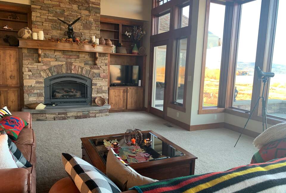 Home Exchange in Polson, Montana family room with cozy fireplace
