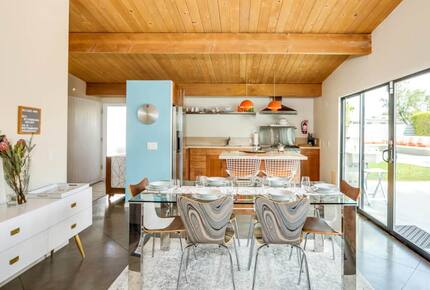 Home Exchange in Palm Springs, CA, stunning glass dining table