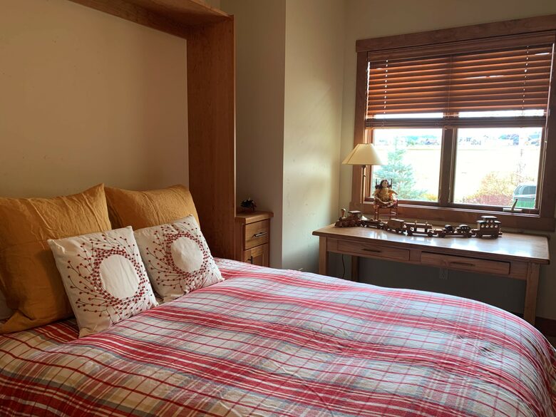 Home Exchange in Polson, Montana guest bedroom three with a desk