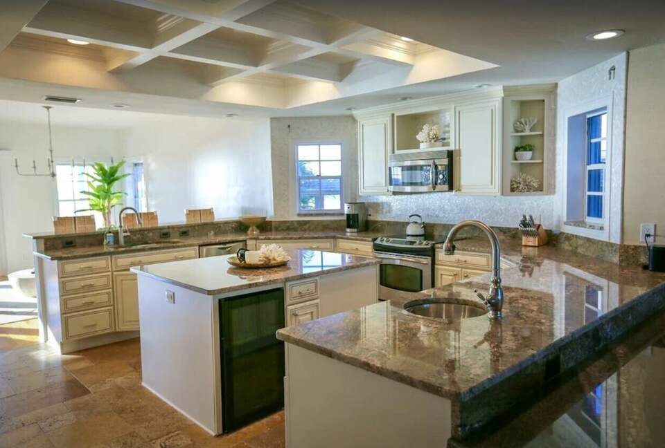 Home Exchange in Indian Shores, FL large granite countertop kitchen