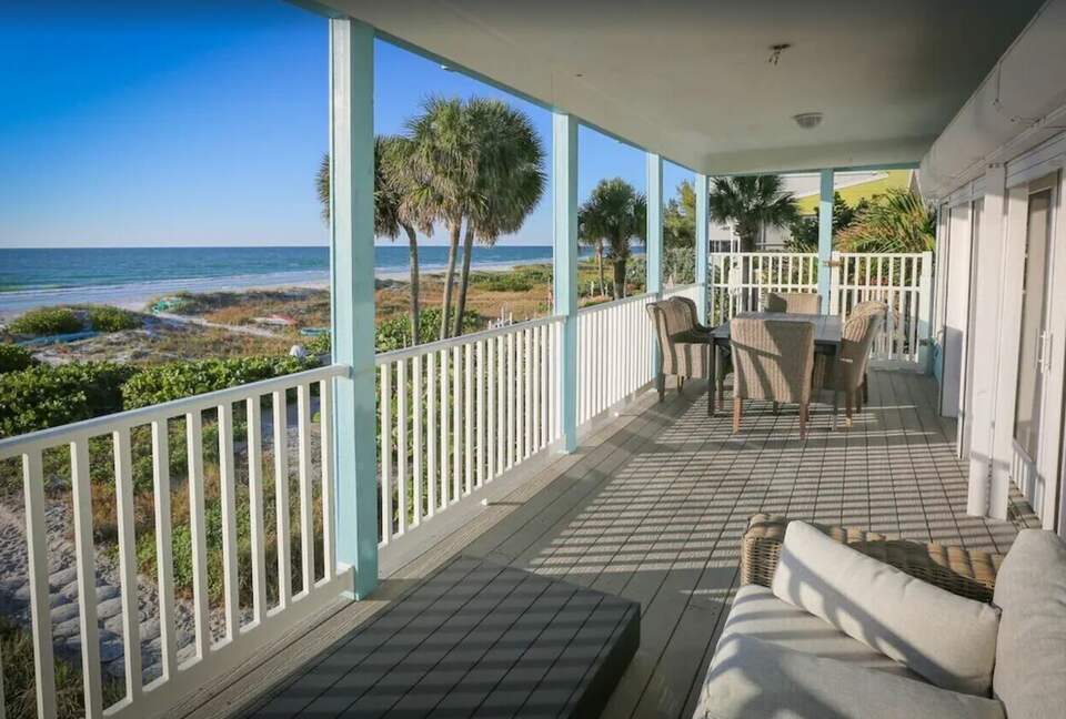 Home Exchange in Indian Shores, FL back deck indoor outdoor living