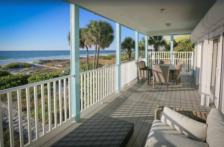 Home Exchange in Indian Shores, FL back deck indoor outdoor living