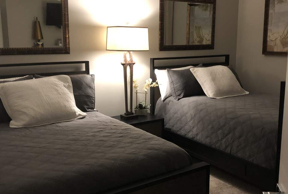 Home Exchange in Orange Beach, AL, guest bedroom with two full beds