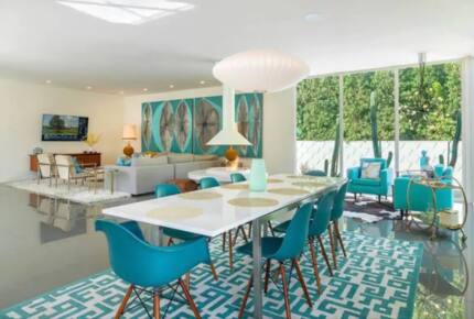 Home Exchange in Palm Springs, CA, dining table and living room