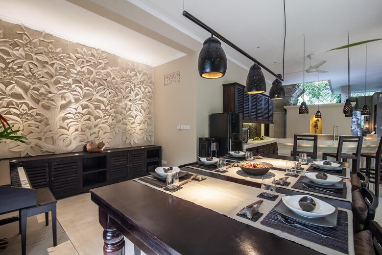 Home exchange in Ubud, Bali, dining table next to piano