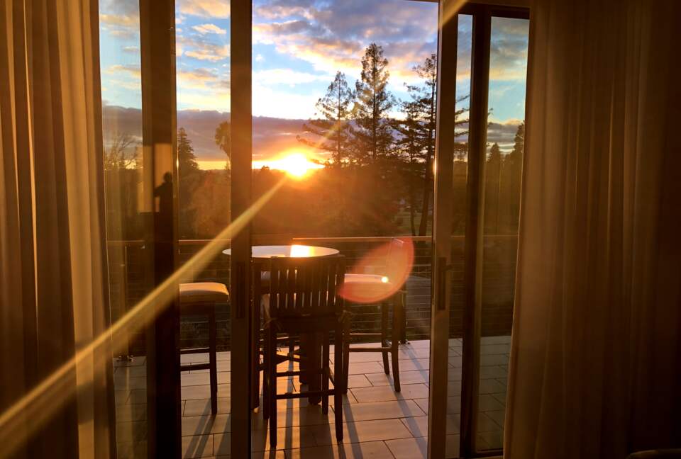 Sitting room balcony with sunset and golf course views