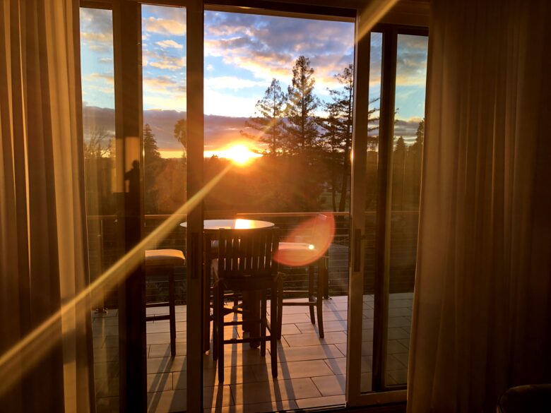 Sitting room balcony with sunset and golf course views