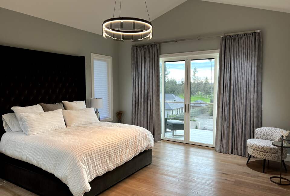 Primary bedroom suite #1 (main level) w/ king bed