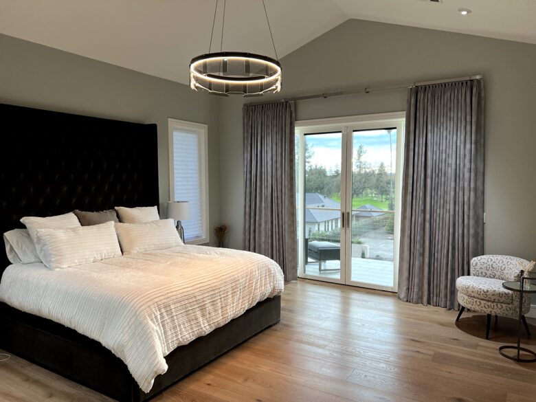 Primary bedroom suite #1 (main level) w/ king bed