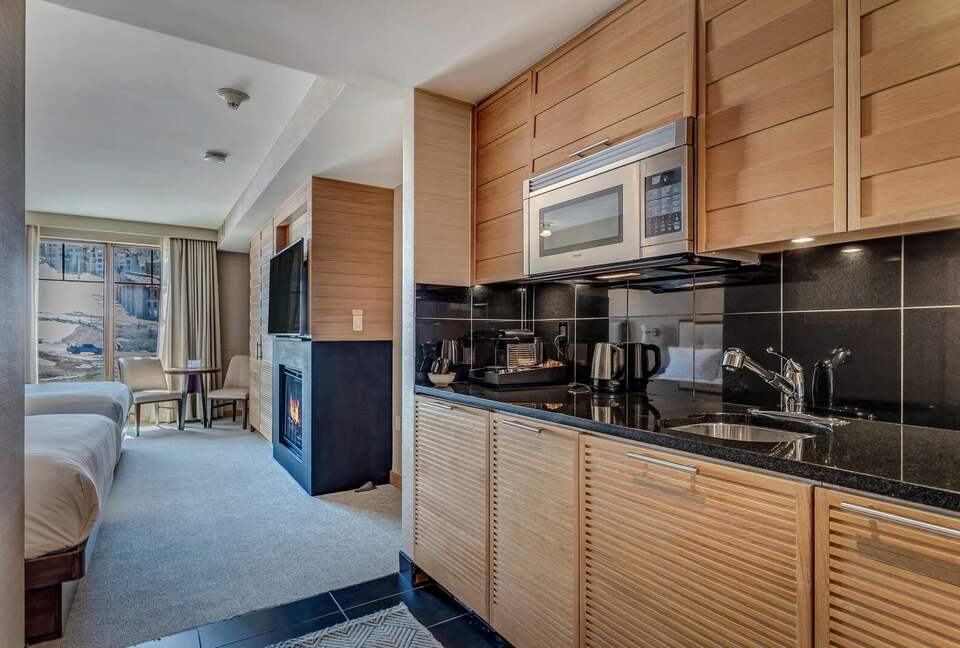 Suite with fireplace and kitchen access