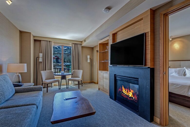 Living room with fireplace and mountain views