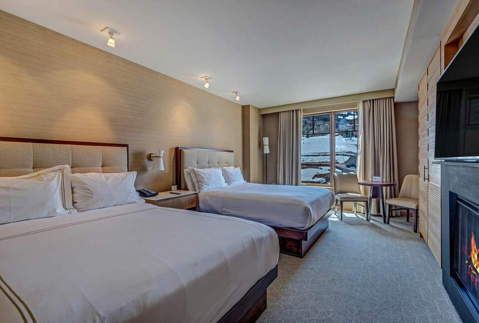 Suite with 2 queen beds, fireplace and mountain views