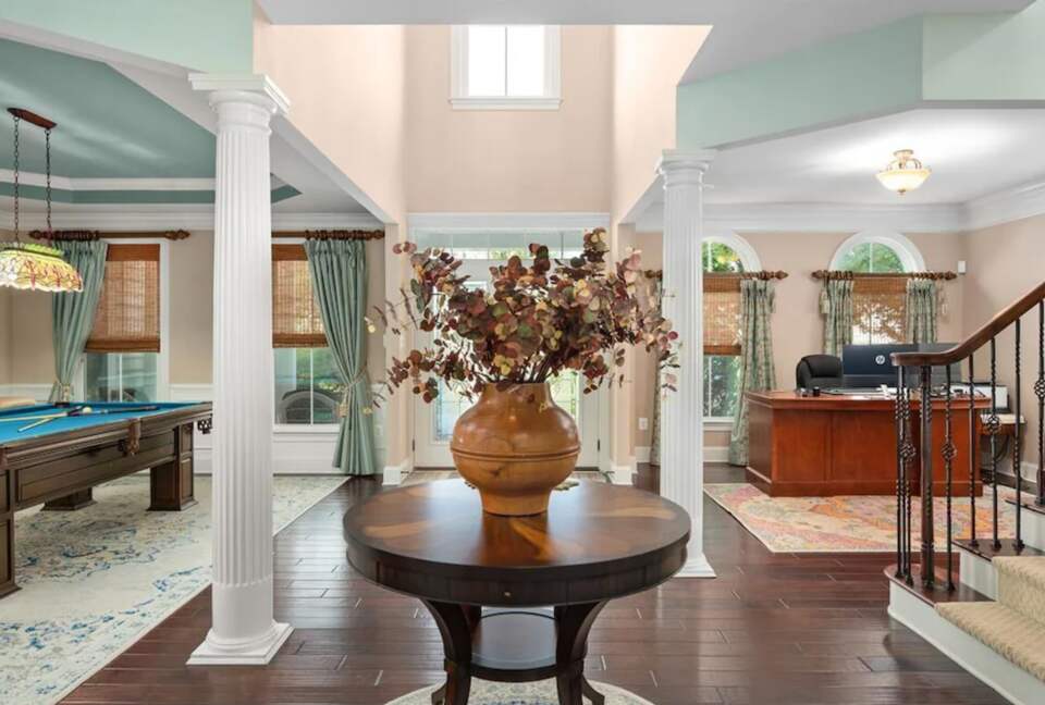 Main living area combining entertainment with a home office