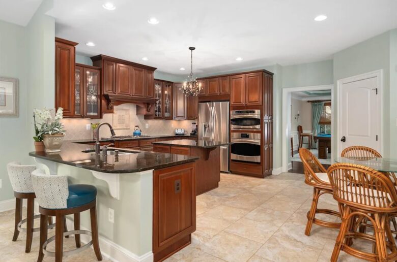 Expansive kitchen with many amenities and eat-in bar