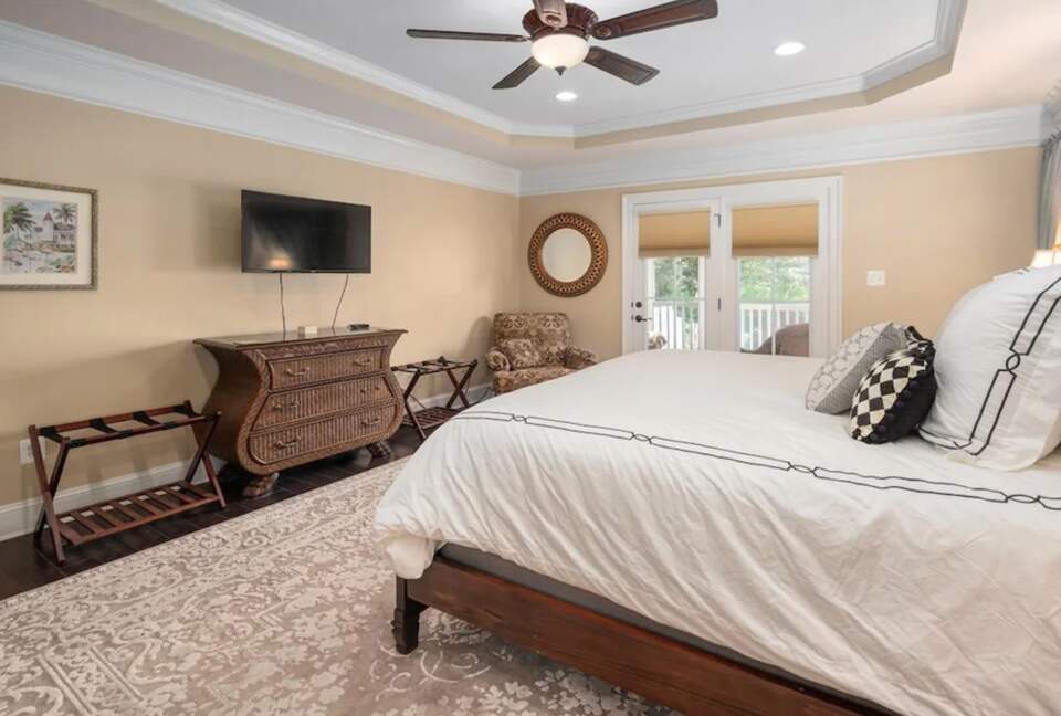Master suite with French doors and TV