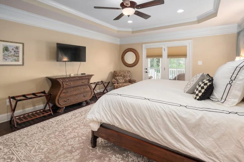 Master suite with French doors and TV
