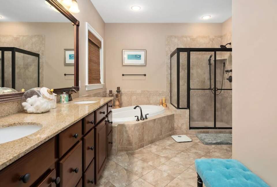 Elegant master bathroom with tile floors and walk in shower