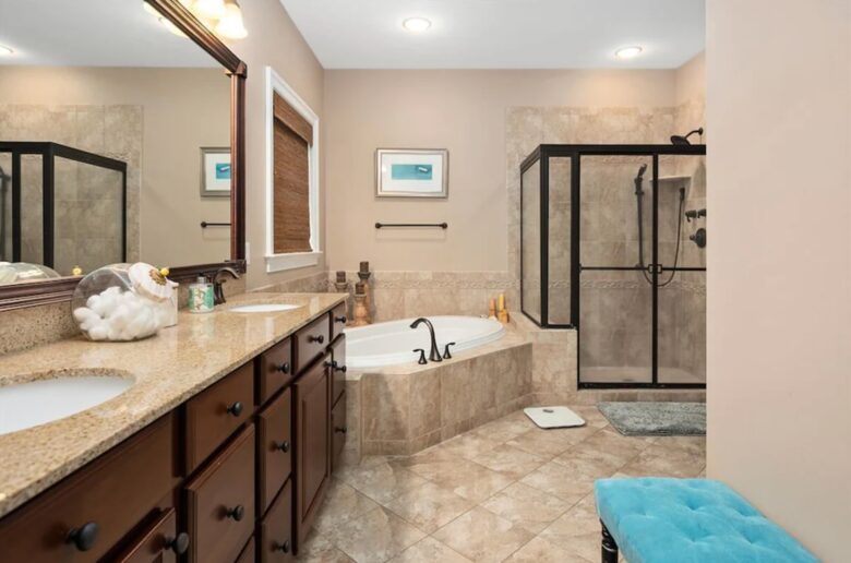 Elegant master bathroom with tile floors and walk in shower