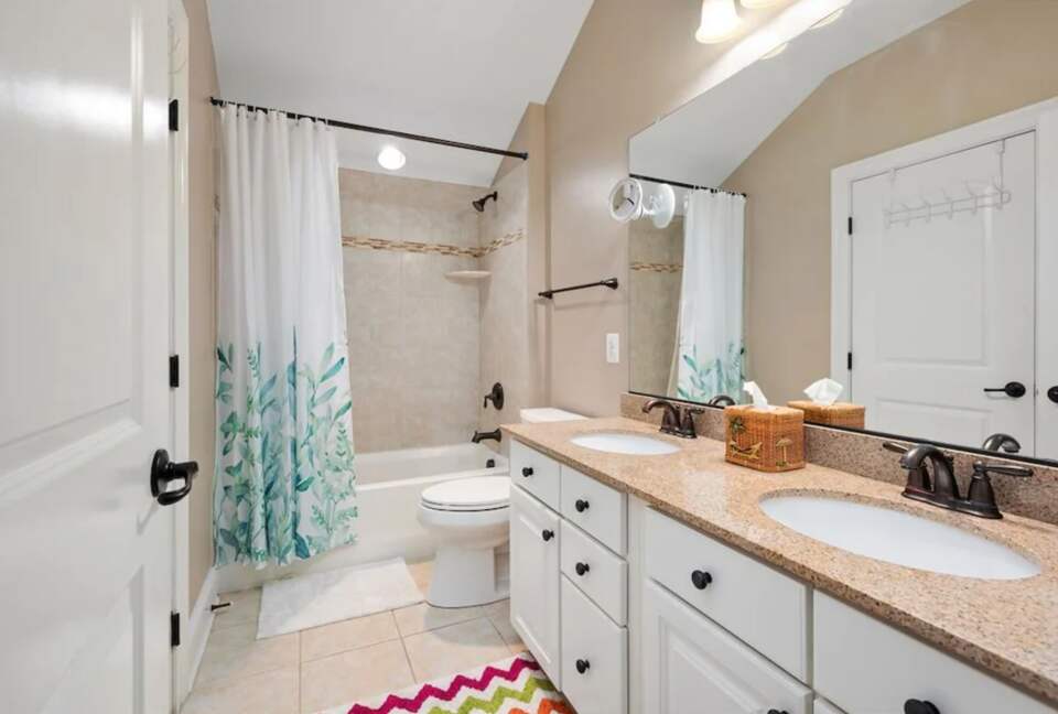 Secondary bathroom with double vanities