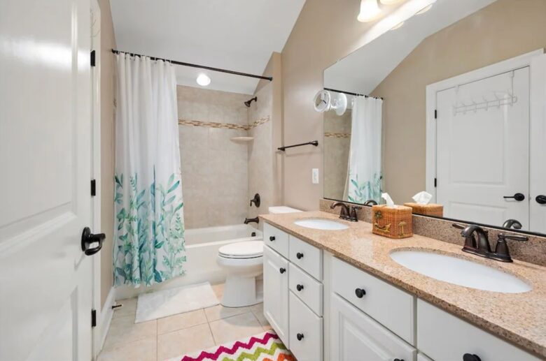 Secondary bathroom with double vanities