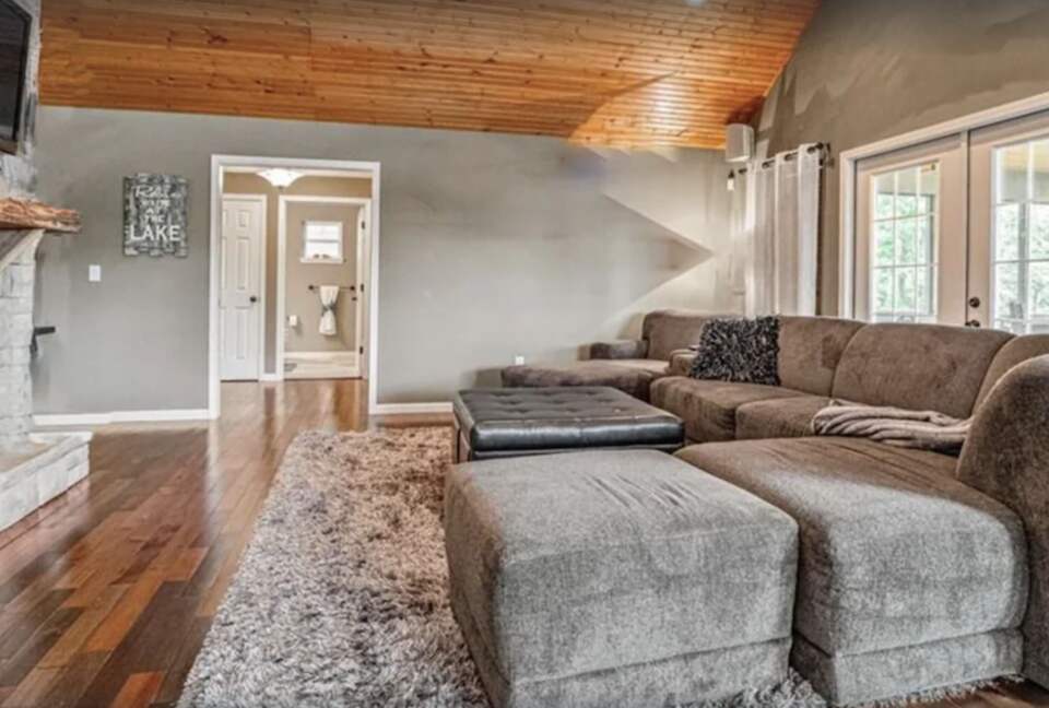 Living room with vaulted ceilings and fireplace
