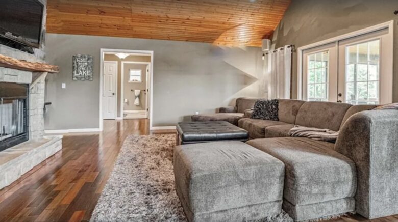 Living room with vaulted ceilings and fireplace