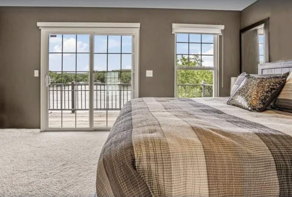 master bedroom with view of lake