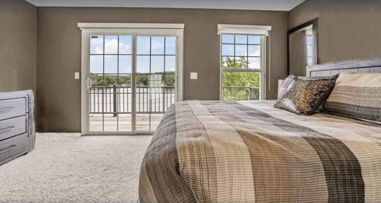 master bedroom with view of lake