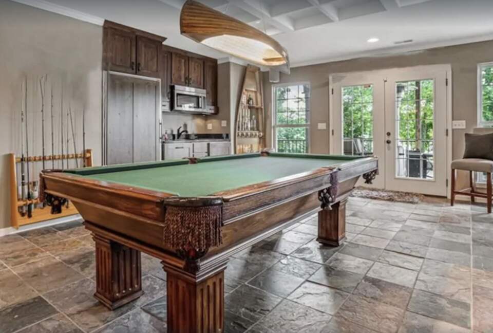 Game room with pool table and kitchenette