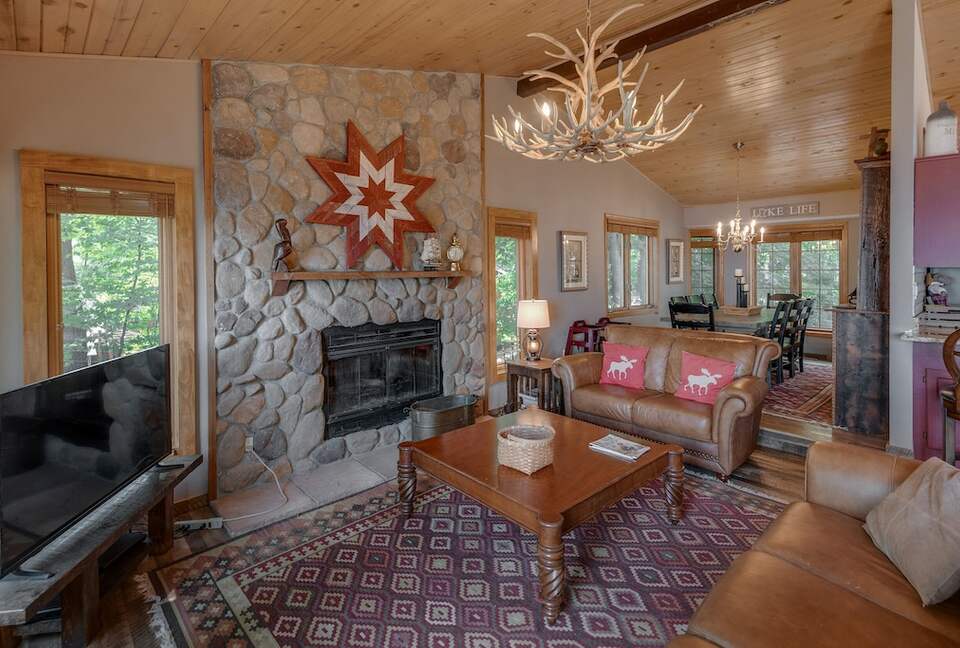 Home Exchange in Nisswa, MN, living room with stone fireplace