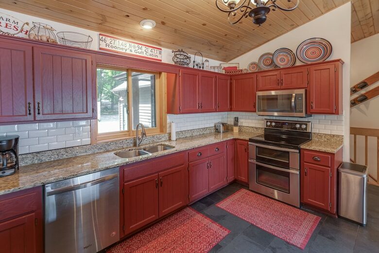 Home Exchange in Nisswa, MN, red kitchen with stainless steel