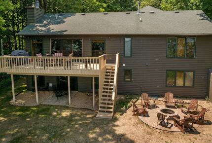 Home Exchange in Nisswa, MN, backyard of the cabin with fire-pit