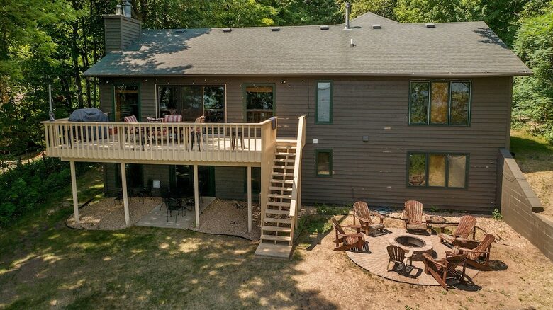 Home Exchange in Nisswa, MN, backyard of the cabin with fire-pit