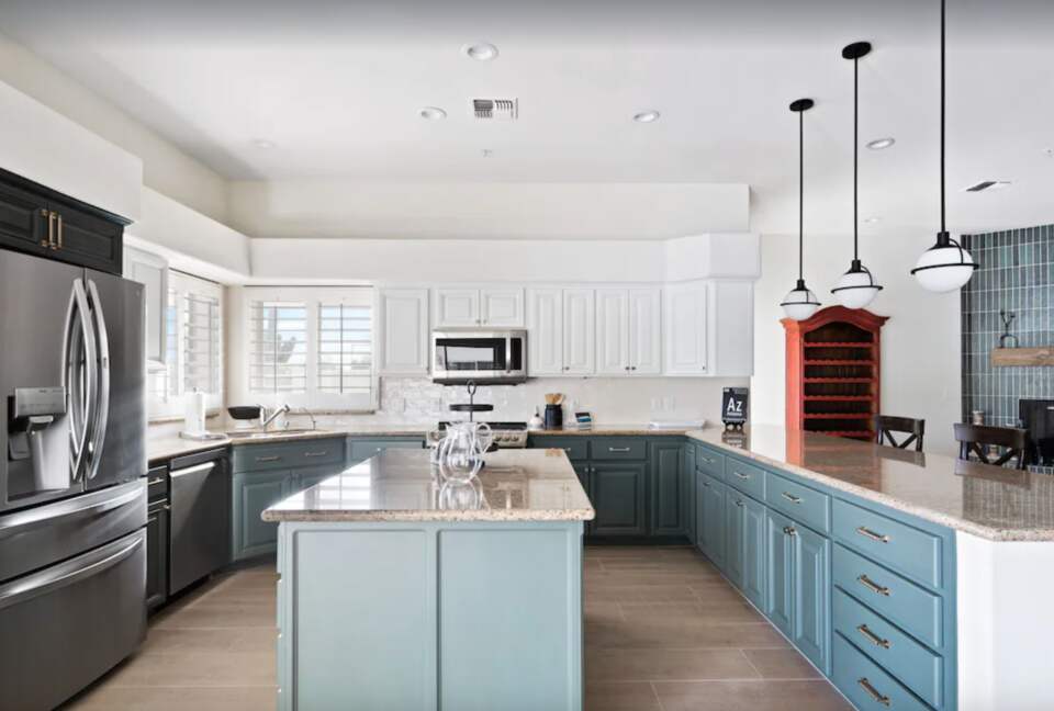 Kitchen with island and granite countertops