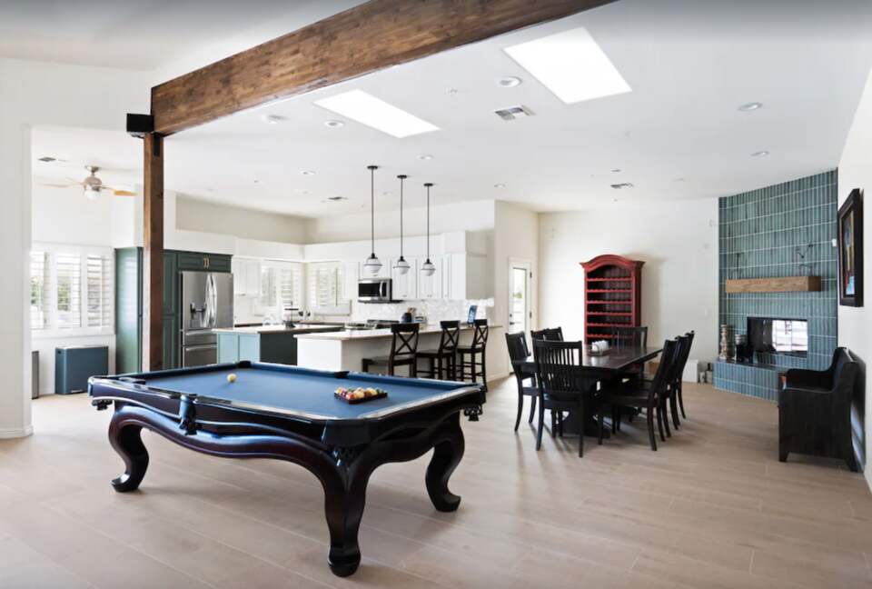 Pool table open to dining and kitchen