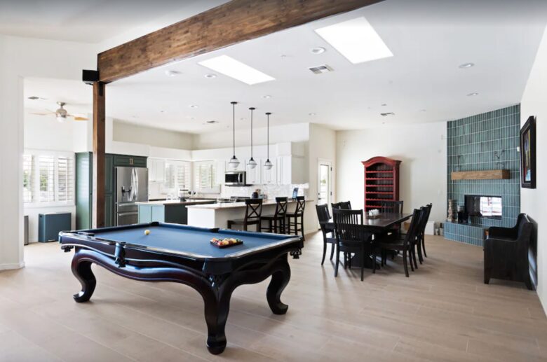 Pool table open to dining and kitchen