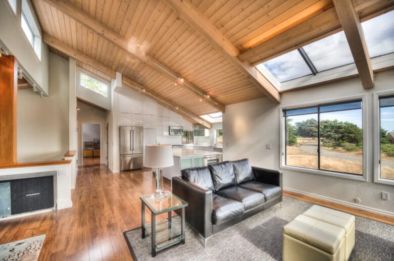 Open living and dining rooms with vaulted ceilings