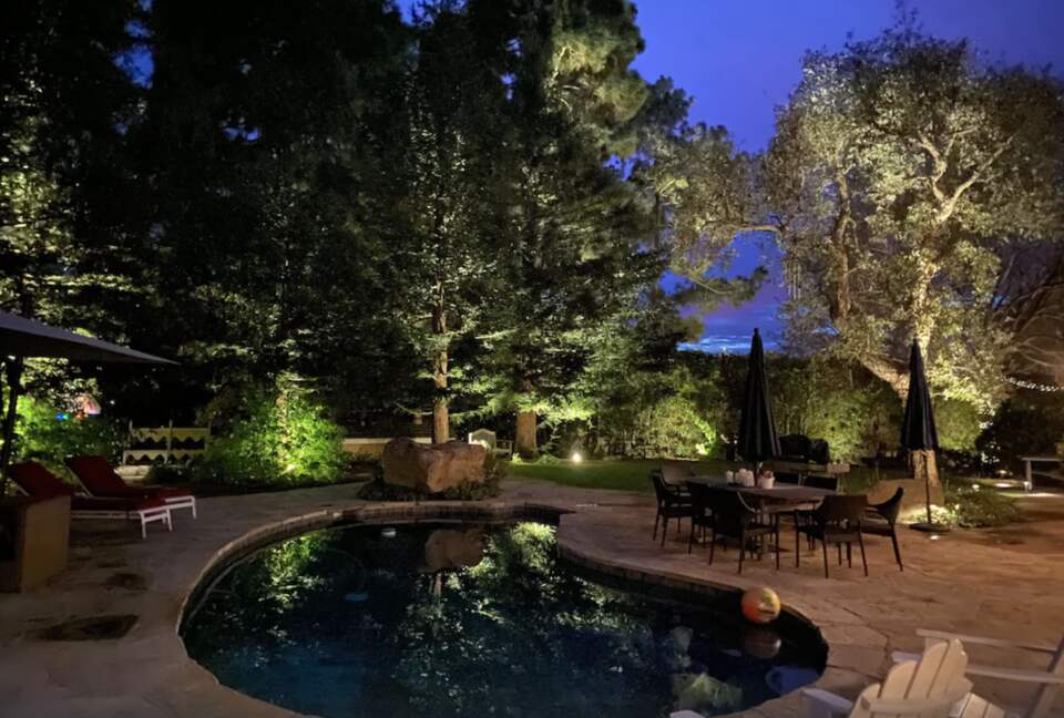 Backyard pool at night