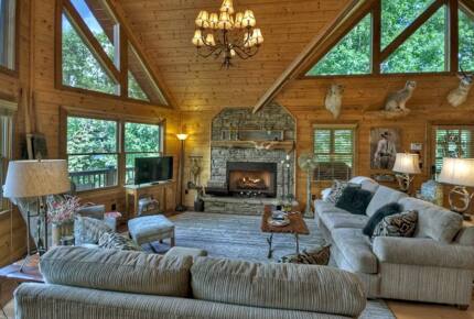 Home Exchange in Mineral Bluff, GA, living room with stone fireplace